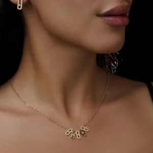 نیم‌ست زنانه طلایی طرح گیره کاغذ نگین‌دار